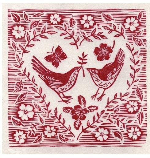 Gravure de deux oiseaux dans un cœur fleuri