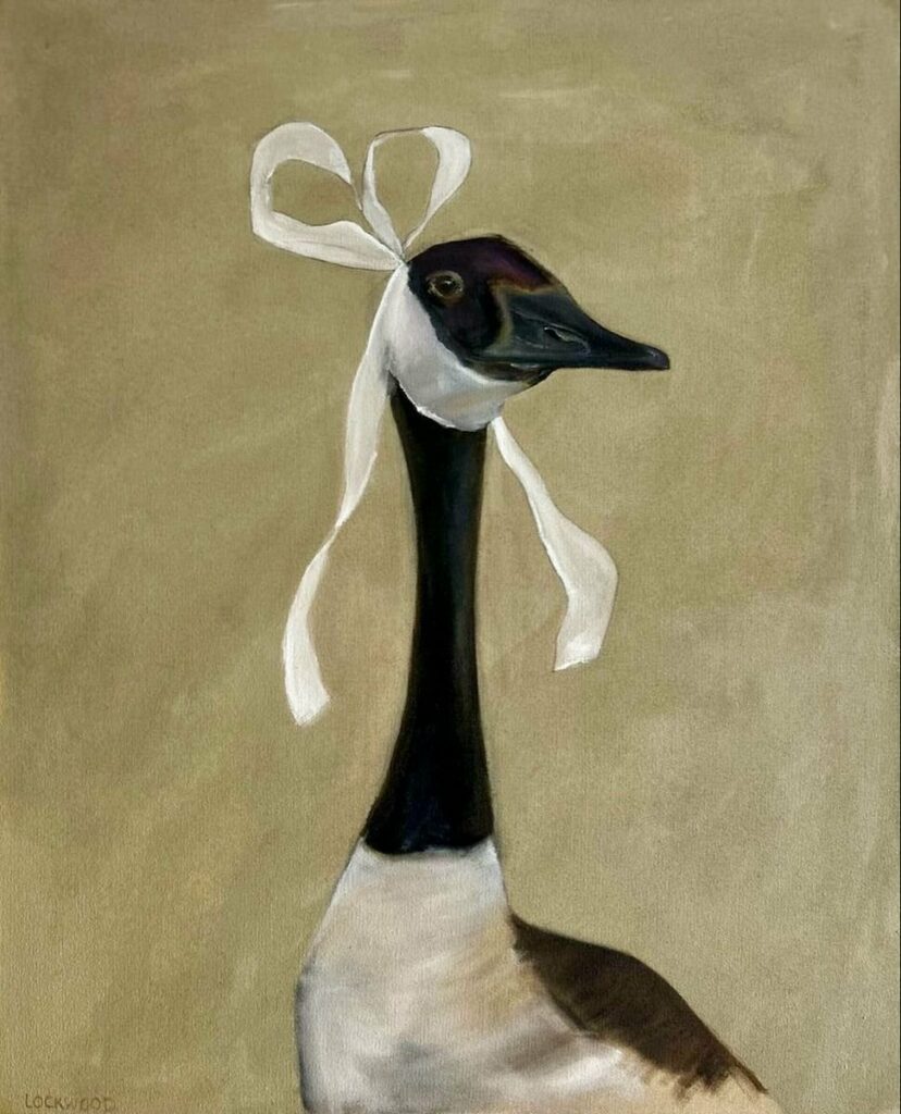 Oie coiffée d’un nœud blanc
