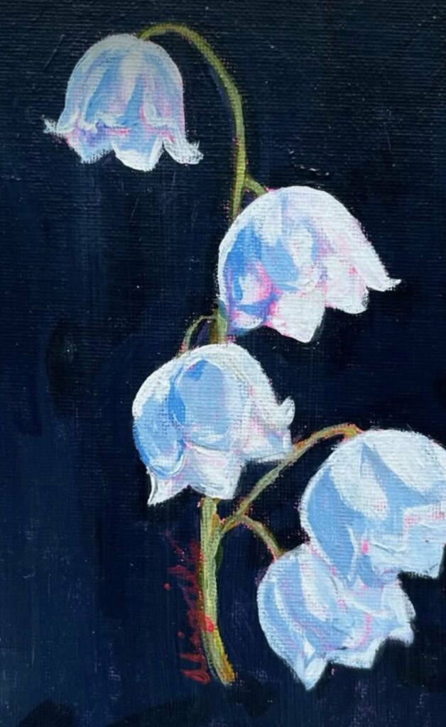 Brins de muguet sur fond bleu nuit